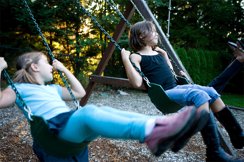 Dave’s two daughters swinging