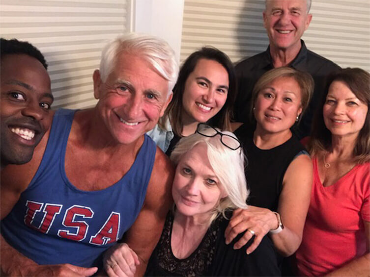 Dave Reichert with six people posing for a picture